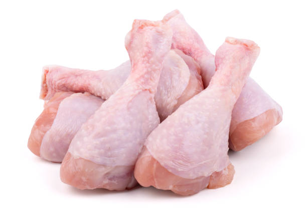 istock group of raw chicken drumsticks isolated on white background 1320815612