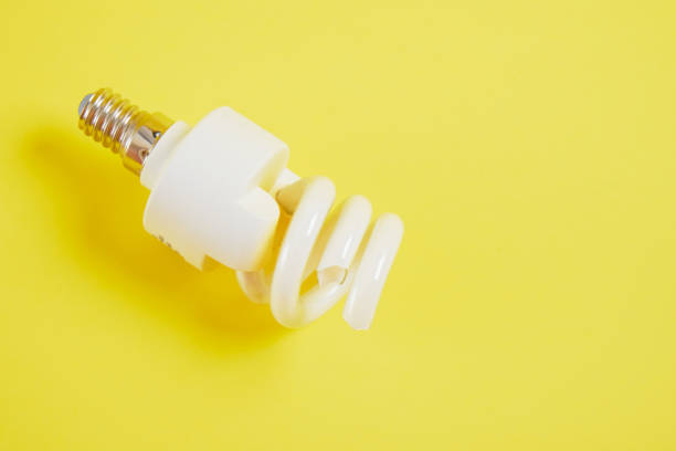 istock broken screw light bulb on trendy yellow background 1320817310