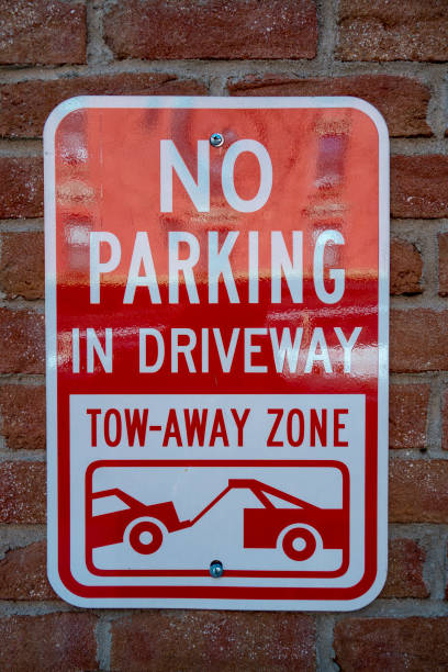 istock No parking sign on brick wall 1320818174