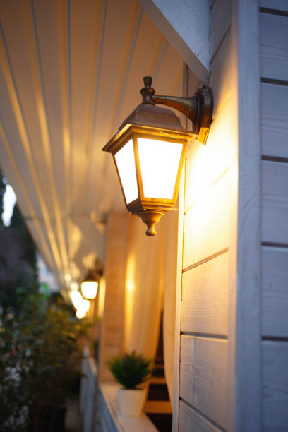 istock street lamp hangs on the wall and shines with warm light 1320821253