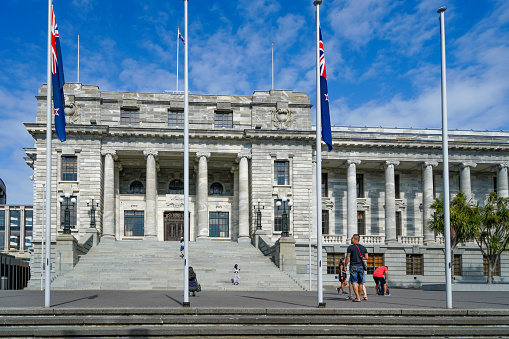 Tourists are visiting Parliament House, New Zealand Parliament Buildings,  Wellington, North Island, New Zealand.