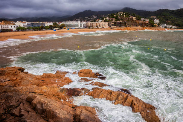 Rough sea on windy day in Tossa de Mar resort town on Costa Brava in Spain.