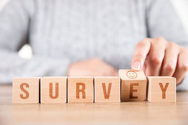istock Survey Concept With A Smiley Face on Wooden Cubes 1320831599