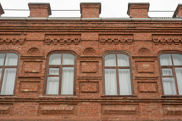 istock Windows in an old brick building. Red brick building. 1320831654