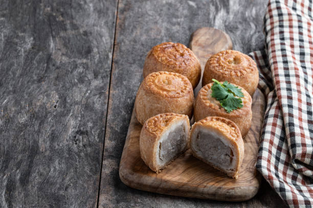 istock Mini Melton Mowbray pork pies on rustic wooden table 1320831671