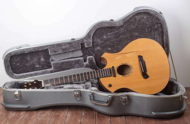 istock Musical instrument - Broken acoustic guitar in hard case closeup 1320832912