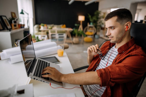 istock Man works in an office on a laptop 1320834482