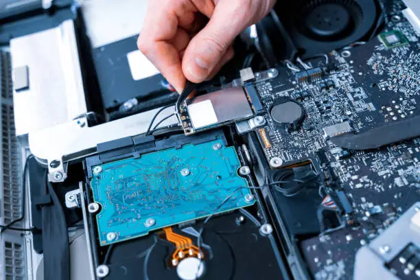 Technology maintenance hardware from man engineer. Repair computers. Electronic technician pc service