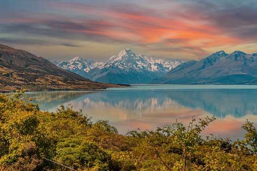 Scenic reflection of Mount Sefton and Mount Cook at lake Pukaki, South Island of New Zealand