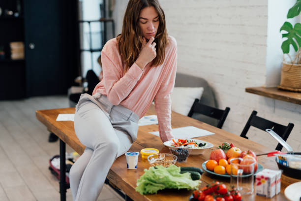 istock Woman sits in the kitchen and thinks about what to cook 1320839222