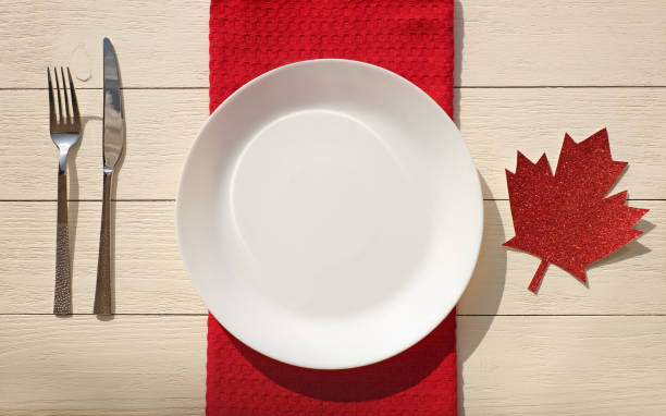 istock Table setting in the style of Canada flag colors, outdoors, mock-up, top view 1320840912