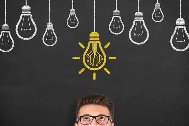 istock Innovative idea concepts with light bulbs on a chalkboard background 1320841871