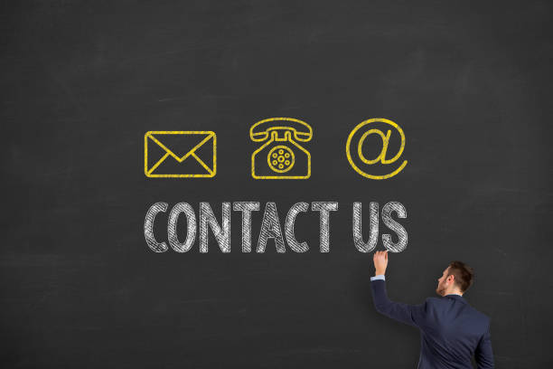 istock Human Hand Drawing Contact Us on Blackboard 1320842052