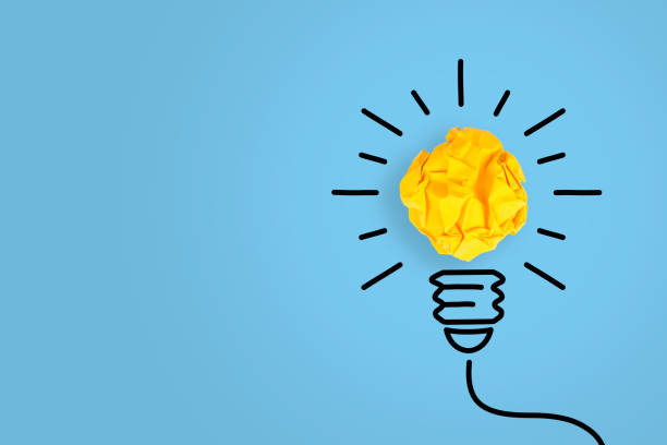 istock Creative Idea Concepts with Light Bulb Crumpled Paper on Blue Background 1320842333