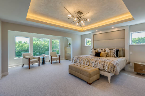 istock Luxurious master bedroom with coffered ceiling and LED lighting 1320842495