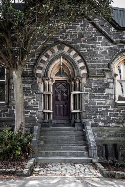 detail of a historic building after 2011 earthquake, secured from collapsing, christchurch in new zealand - lock door horror gate imagens e fotografias de stock