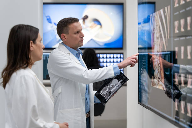 Medical professionals evaluating MRI scans.