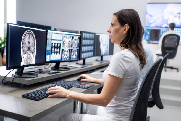 istock Female doctor analyzing brain MRI scan result on computer. 1320844600