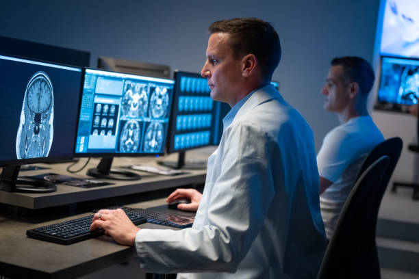 istock Caucasian doctor analyzing patient brain MRI scan result on computer. 1320844604