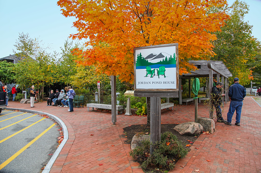 Acadia National Park, Maine, USA - October 11, 2018: Tourists waiting for buses at the Jordan Pond House in Acadia National Park