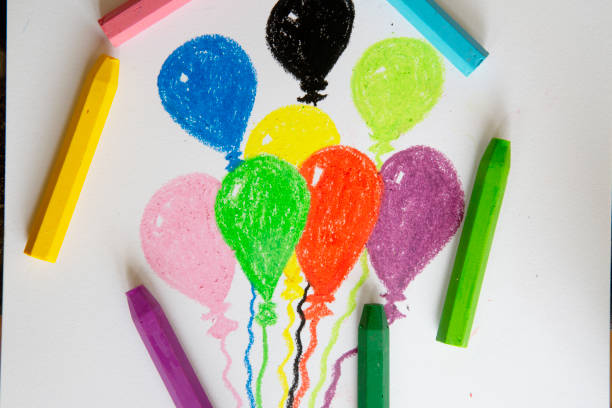 istock Drawing of Child Holding Balloons 1320852107