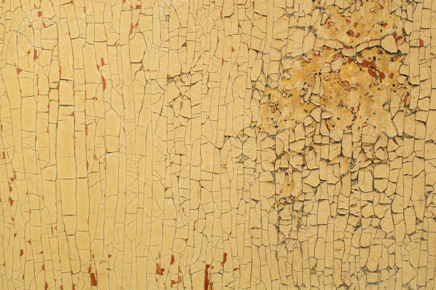 istock The texture of peeling paint on the old wall. 1320852378