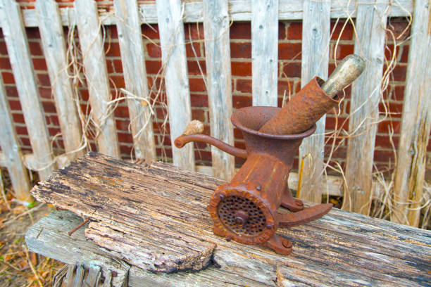istock Old Meat Grinder-Mounted on a log--Howard County Indiana 1320853856