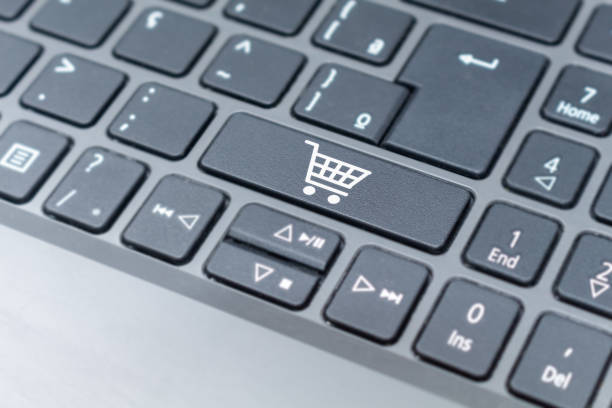 istock Key on laptop keyboard with shopping cart icon. 1320854063
