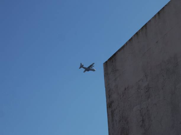 istock war plane over the city 1320858790
