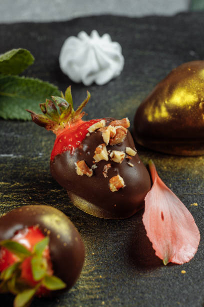 istock Fresh chocolate covered strawberries on a gray decorative background. Concept for advertising the summer seasonal menu 1320861027