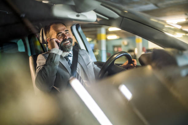 istock Businessman driving a car. 1320868249