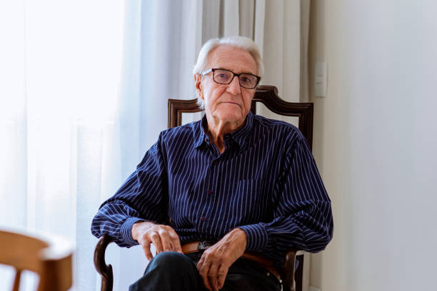 istock Mister sitting on old candlestick looking at camera 1320868460