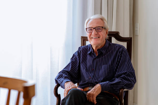 istock Mister sitting on old candlestick looking at the camera and smiling 1320868473