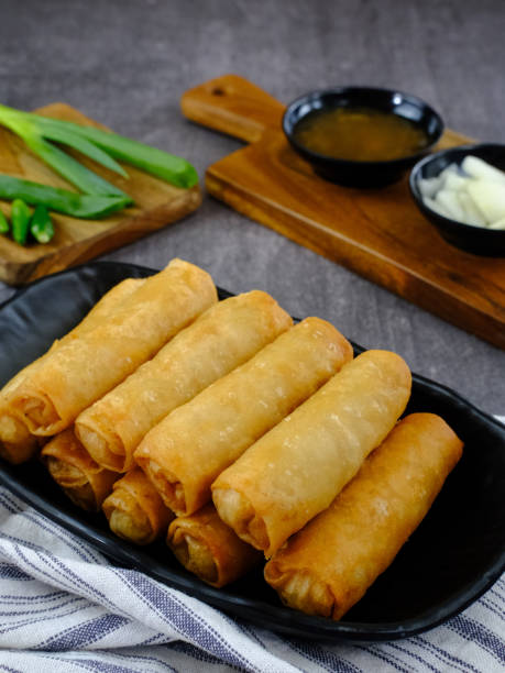 istock Lumpia or lunpia, a traditional snack from Semarang, Central Java, Indonesia. Traditional Spring rolls food containing eggs, and chicken or shrimp. 1320879965