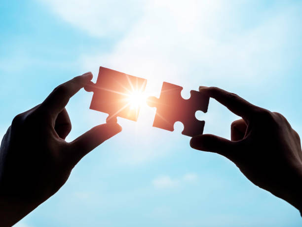 istock Jigsaw puzzle against blue sky background, silhouette. 1320881771