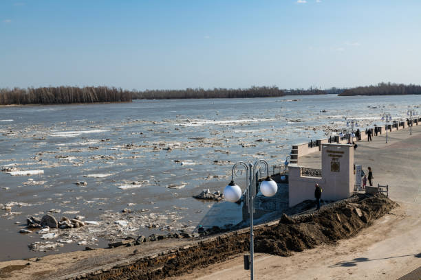 Barnaul. Russia. April 16, 2021. Embankment observation deck near the river station and Nagorny Park. People watch the ice drift on the Ob River.