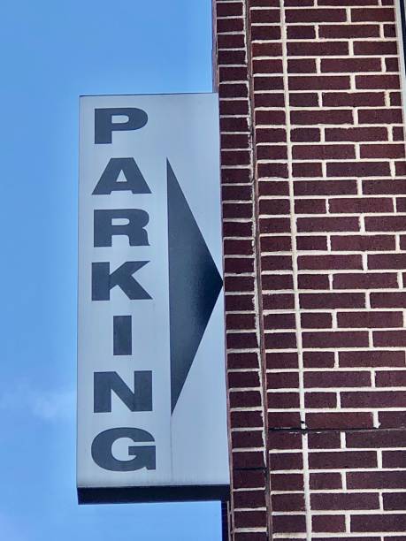 istock Parking Sign on Brick Building 1320886970