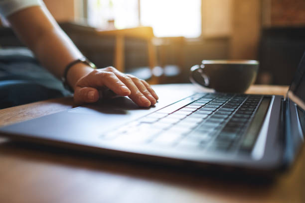 istock a woman working and touching on laptop touchpad on the table 1320889673