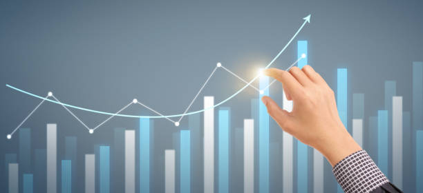 istock Hand  plan graph growth and increase of chart positive indicators in his business 1320890411