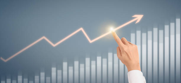 istock Hand  plan graph growth and increase of chart positive indicators in his business 1320890423