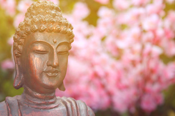 istock Buddha Statue in Outdoor Garden With Blurred Background 1320893266