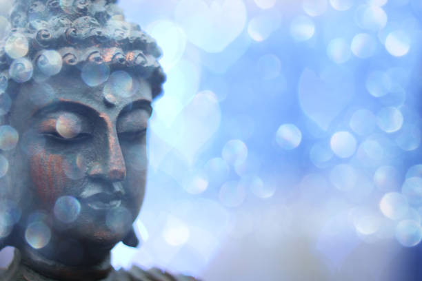 istock Buddha Statue in Outdoor Garden With Blurred Background 1320893411