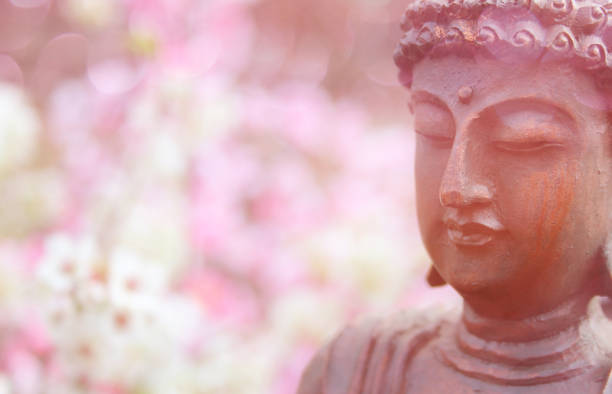 istock Buddha Statue in Outdoor Garden With Blurred Background 1320893423