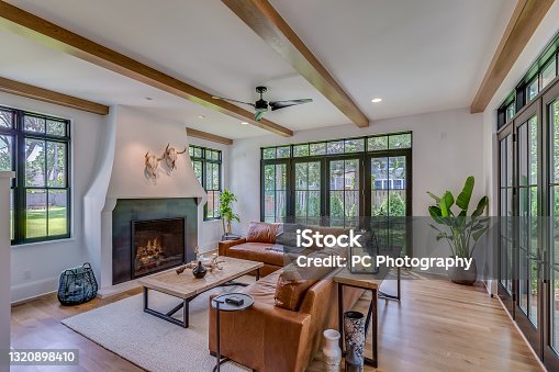 istock Luxury great room with lots of glass windows 1320898410