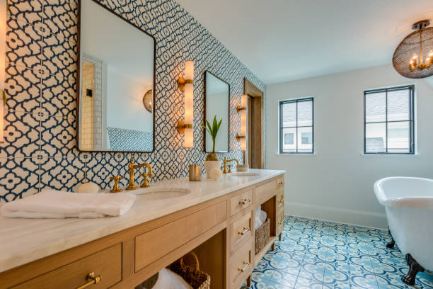 istock Blue and white patterned tile in bathroom with free standing tub 1320898424