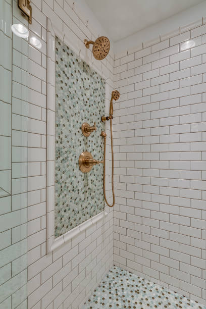 istock White subway tile in new shower with bench 1320898431