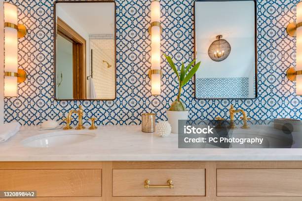 Blue And White Patterned Tile In Bathroom With Natural Wood Stock Photo - Download Image Now