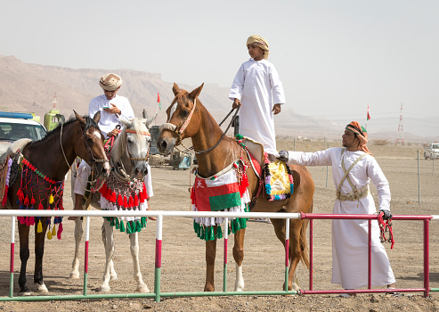 khadal, Oman,28th April 2018: omani men in traditional clothing, standing on their horses