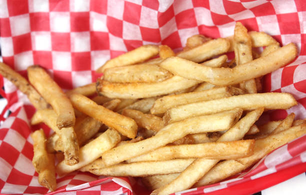 istock French Fried Potatoes in Retro Cafe With Checkered Paper 1320900675