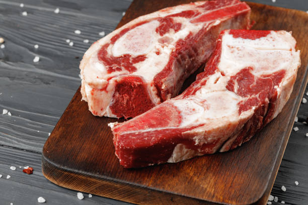 istock Uncooked raw beef brisket on wooden board 1320901434